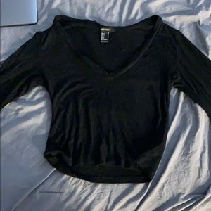 Black crop top with flared sleeves